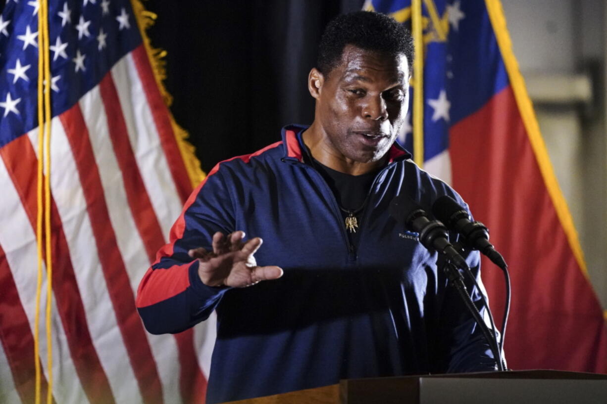 Republican nominee for U.S Senate Herschel Walker speaks during a campaign rally Thursday, Nov. 10, 2022 in Canton, Ga.. Walker is in a runoff with incumbent Democrat Raphael Warnock.