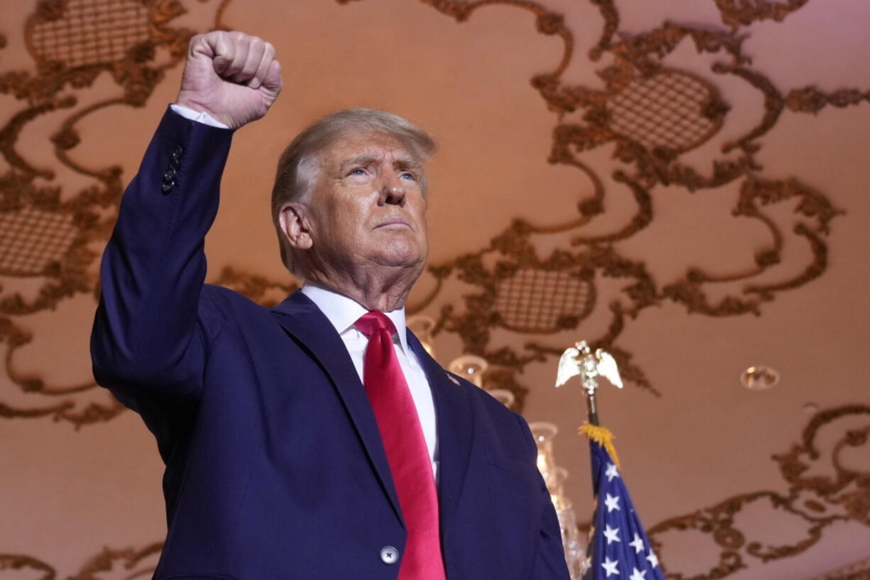 FILE - Former President Donald Trump stands on stage after announcing a third run for president at Mar-a-Lago in Palm Beach, Fla., Nov. 15, 2022. Trump has spent years teasing the prospect of another presidential run. But in the first week since announcing his third bid for the White House, he's done little to suggest that he's organizing a traditional campaign.