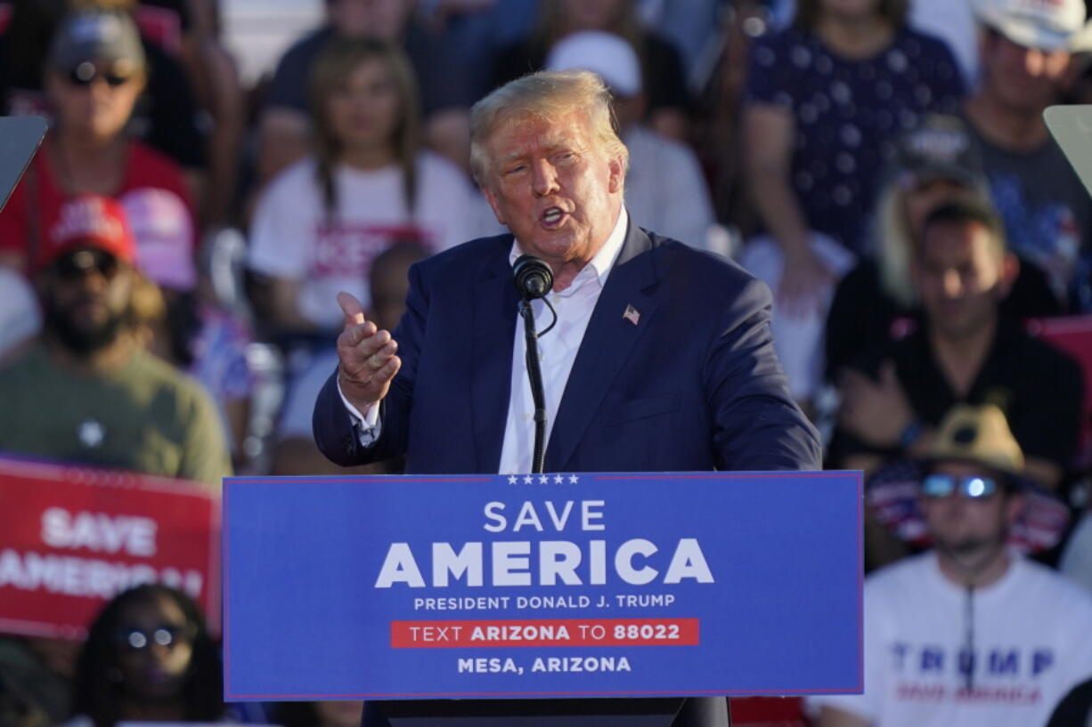 FILE - Former President Donald Trump speaks at a rally, Oct. 9, 2022, in Mesa, Ariz. Trump has been teasing another presidential run since before he left the White House. But aides to the former president are now preparing for a 2024 campaign that could be announced soon after next week's midterms.