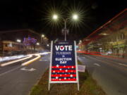 A sign reminds residents to do their civic duty on Election Day, Tuesday, Nov. 8, 2022, in Lewiston, Maine. (AP Photo/Robert F.