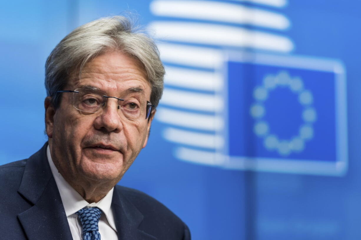 FILE - European Commissioner for Economy Paolo Gentiloni speaks during a media briefing after a meeting of eurogroup finance ministers at the European Council building in Brussels on Monday, Dec. 6, 2021. The European Commission's autumn forecast released Friday, Nov. 11, 2022, predicts falling economic output in the last three months of this year and the first months of 2023.