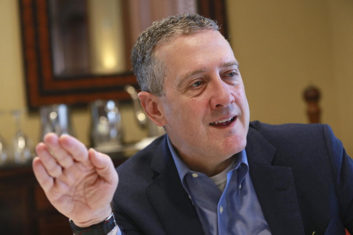 FILE - In this Nov. 19, 2019, photo James Bullard, president of the St. Louis Federal Reserve Bank, gestures during an interview in Richmond, Va. The Federal Reserve may have to raise its benchmark interest rate much higher than many people expect to get inflation under control, Bullard said Thursday, Nov. 17, 2022.