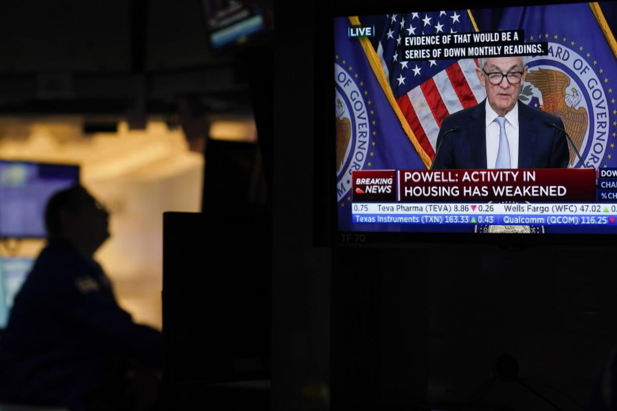 Traders work on the floor at the New York Stock Exchange as the Federal Reserve chairman Jerome Powell speaks after announcing a rate increase in New York, Wednesday, Nov. 2, 2022.