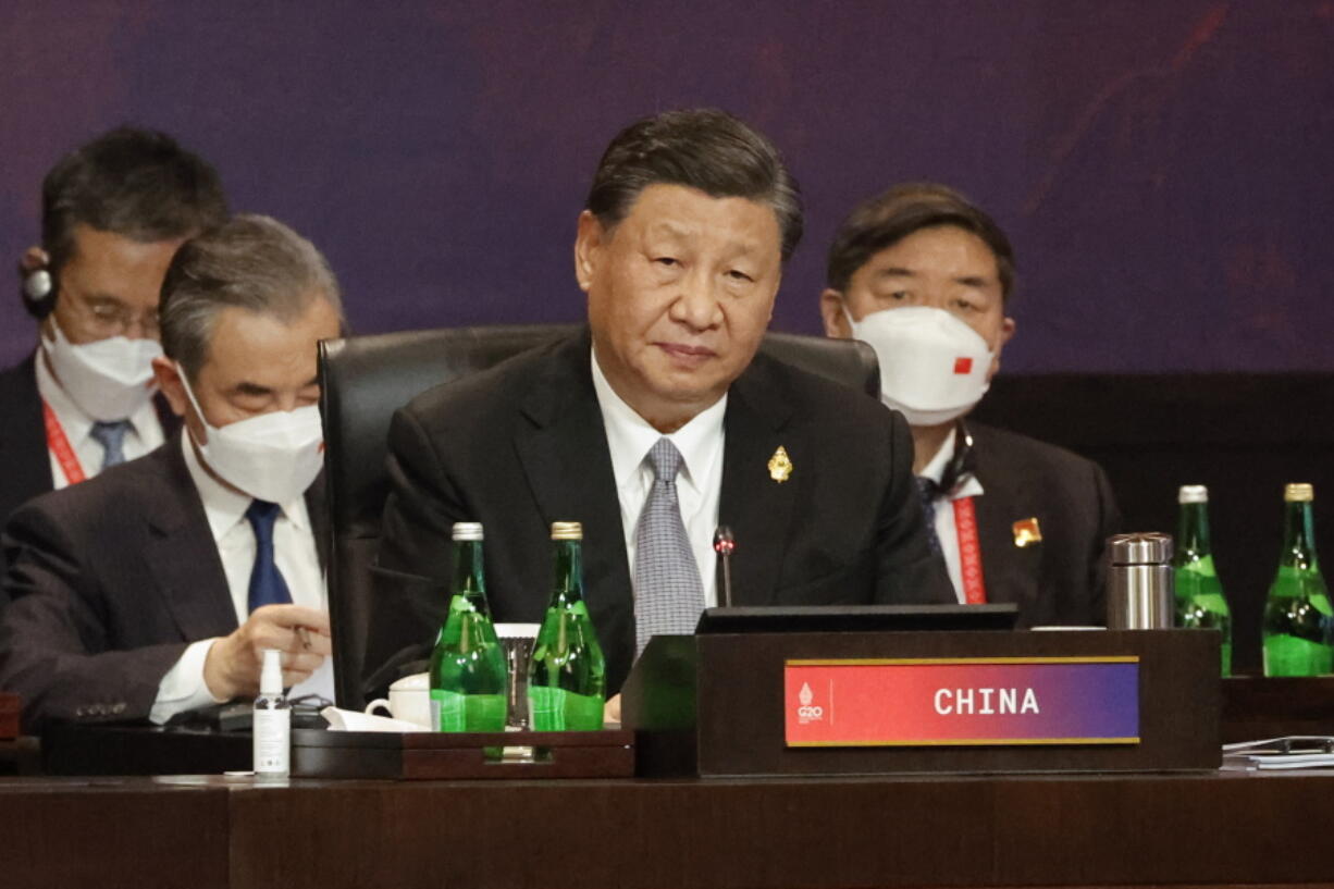 FILE - Chinese President Xi Jinping attends a session at the G20 Leaders' Summit in Nusa Dua, Bali, Indonesia, Wednesday, Nov. 16, 2022. China and India, after months of refusing to condemn Russia's war in Ukraine, did not stand in the way of the public release this week of a statement by the world's leading economies that strongly criticizes Moscow.