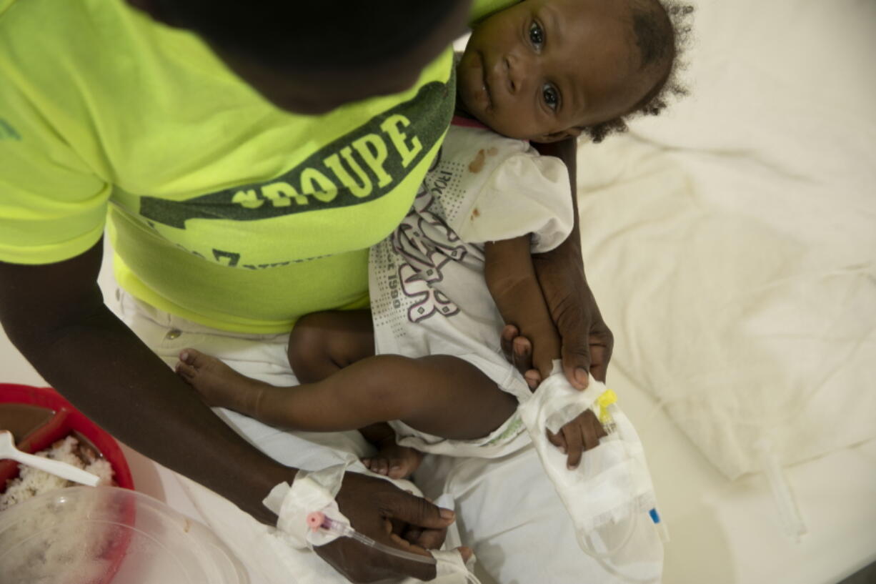 A baby stricken with cholera receives treatment at a clinic run by Doctors Without Borders in Port-au-Prince, Haiti, Friday, Nov. 11, 2022.