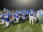 La Center head coach John Lambert addresses his team in the post-game huddle after the Wildcats' 63-14 win over Hoquiam in Week 10 on Nov. 4, 2022, at Woodland High School.