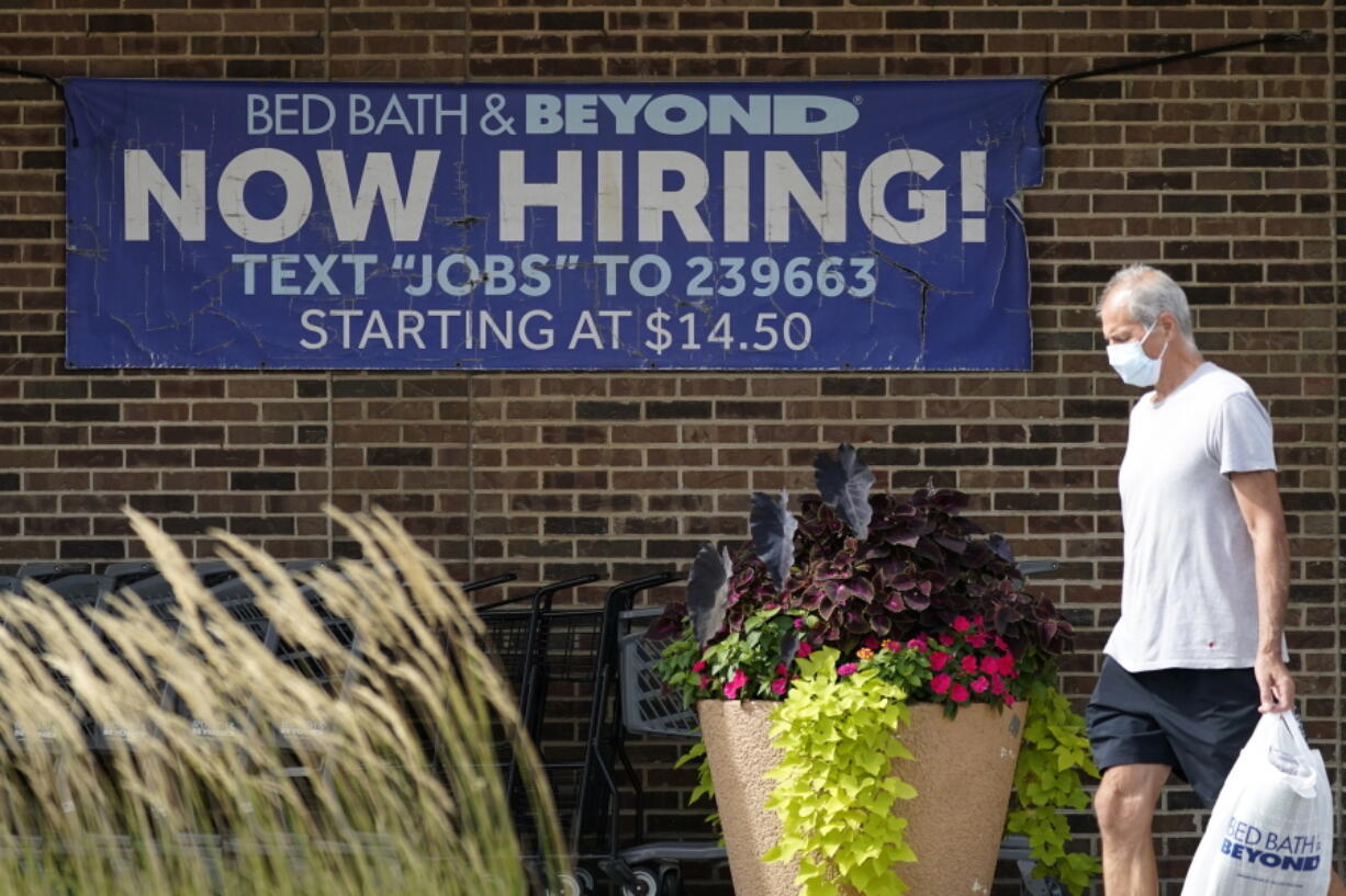 FILE - A hiring sign is displayed in Deerfield, Ill., Wednesday, Sept. 21, 2022. On Tuesday the Labor Department reports on job openings and labor turnover for September.  U.S. job openings rose unexpectedly in September 2022, suggesting that the American labor market is not cooling as fast as the inflation fighters at the Federal Reserve hoped. Employers posted 10.7 million job vacancies in September, up from 10.2 million in August, the Labor Department said Tuesday. Economists had expected the number of job openings to drop below 10 million.(AP Photo/Nam Y.