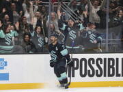 Seattle Kraken right wing Jordan Eberle celebrates after scoring in overtime during the team's NHL hockey game against the Los Angeles Kings on Saturday, Nov. 19, 2022, in Seattle. The Kraken won 3-2.