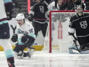 Seattle Kraken center Matty Beniers, left, celebrates his goal as Los Angeles Kings goaltender Jonathan Quick sits in goal during the second period of an NHL hockey game Tuesday, Nov. 29, 2022, in Los Angeles. (AP Photo/Mark J.