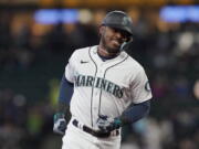 Seattle Mariners' Kyle Lewis has been traded to the Arizona Diamondbacks for catcher/outfielder Cooper Hummel, according to a person with direct knowledge of the deal on Thursday, Nov. 17, 2022. (AP Photo/Ted S.