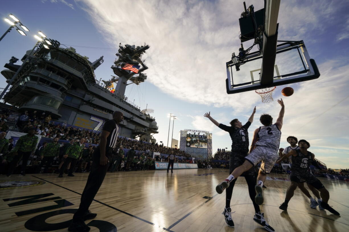 Gonzaga forward Drew Timme (2) shoots against Michigan State forward Jaxon Kohler (0) during the first half of the Carrier Classic NCAA college basketball game aboard the USS Abraham Lincoln in Coronado, Calif. Friday, Nov. 11, 2022.