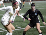 Bishop Blanchet's Kaya Hanson (left) and Mountain View's Teaghan Irvin battle for possession of the ball during a Class 3A girls soccer state round-of-20 match at McKenzie Stadium on Tuesday, Nov. 8, 2022.