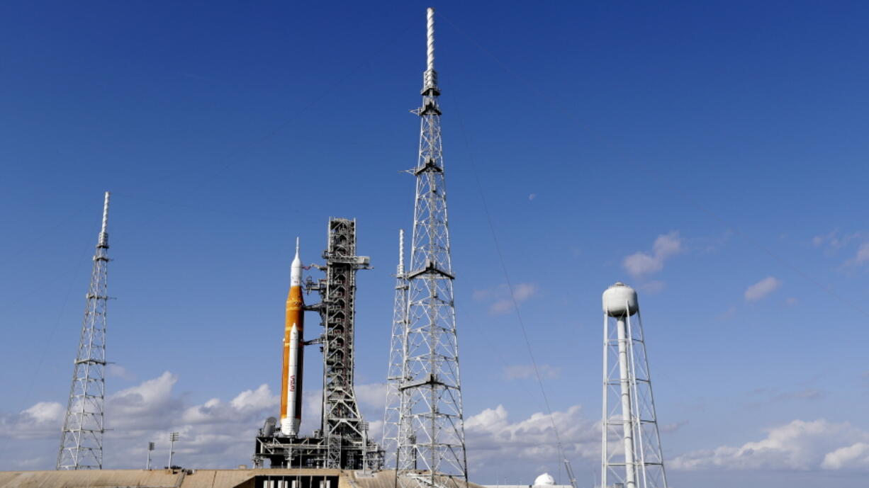 NASA's new moon rocket sits on Launch Pad 39-B Monday, Nov. 14, 2022, in Cape Canaveral, Fla. NASA's 21st-century moon-exploration program, named Artemis after Apollo's mythological twin sister. NASA is targeting an early Wednesday morning launch attempt.