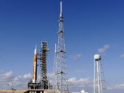 NASA's new moon rocket sits on Launch Pad 39-B Monday, Nov. 14, 2022, in Cape Canaveral, Fla. NASA's 21st-century moon-exploration program, named Artemis after Apollo's mythological twin sister. NASA is targeting an early Wednesday morning launch attempt.