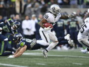 Las Vegas Raiders running back Ameer Abdullah carries against the Seattle Seahawks during the first half of an NFL football game Sunday, Nov. 27, 2022, in Seattle.
