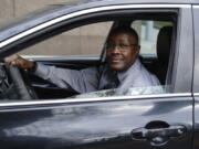 Pastor Kenneth Drayton of Mantels of Promise Ministries sits in his car Nov. 15 in New York. "You don't always have to go to a church or sanctuary to experience the restoration and the power of God," said Drayton, 61, an ordained minister who also drives part-time for a ride-hailing service.