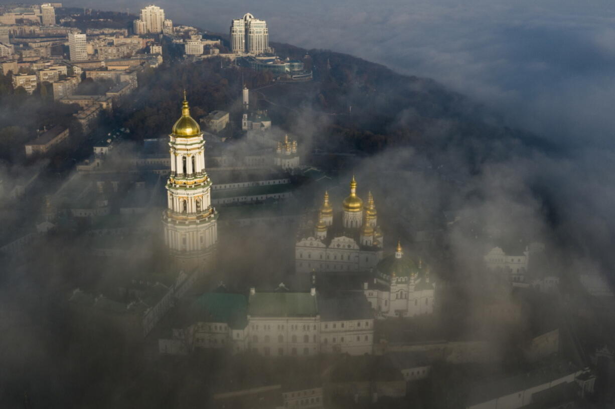 FILE - An aerial photo shows the thousand-year-old Monastery of Caves, also known as Kiev Pechersk Lavra, the holiest site of Eastern Orthodox Christians taken through morning fog during a sunrise in Kyiv, Ukraine, Saturday, Nov. 10, 2018. Ukraine's counter-intelligence service, police and the country's National Guard on Tuesday, Nov. 22, 2022 searched the Pechersk Lavra monastic complex, one of the most famous Orthodox Christian sites in the capital, Kyiv, after a priest spoke favorably about Russia - Ukraine's invader - during a service there.