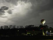 Lightning brightens the evening sky in Jackson, Miss., Tuesday, Nov. 29, 2022. Area residents were provided a light show as severe weather accompanied by some potential twisters affected parts of Louisiana and Mississippi. (AP Photo/Rogelio V.