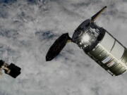 This photo provided by NASA shows a Northrop Grumman cargo ship about to be captured by the International Space Station's robot arm on Wednesday, Nov. 9, 2022. The capsule delivered more than 8,000 pounds of supplies to the International Space Station on Wednesday, despite a jammed solar panel.