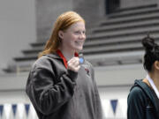 Campbell Deringer of Camas holds her medal after placing second in the 100 breaststroke in the Class 4A meet at the state swim meet at Federal Way on Saturday, Nov. 12, 2022.