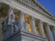 Light illuminates part of the Supreme Court building on Capitol Hill in Washington, Wednesday, Nov. 16, 2022.