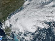 This GOES-East GoeColor satellite image taken at 2:36 p.m. EST and provided by NOAA shows Tropical Storm Nicole approaching toward the northwestern Bahamas and Florida's Atlantic coastline on Tuesday, Nov. 8, 2022.