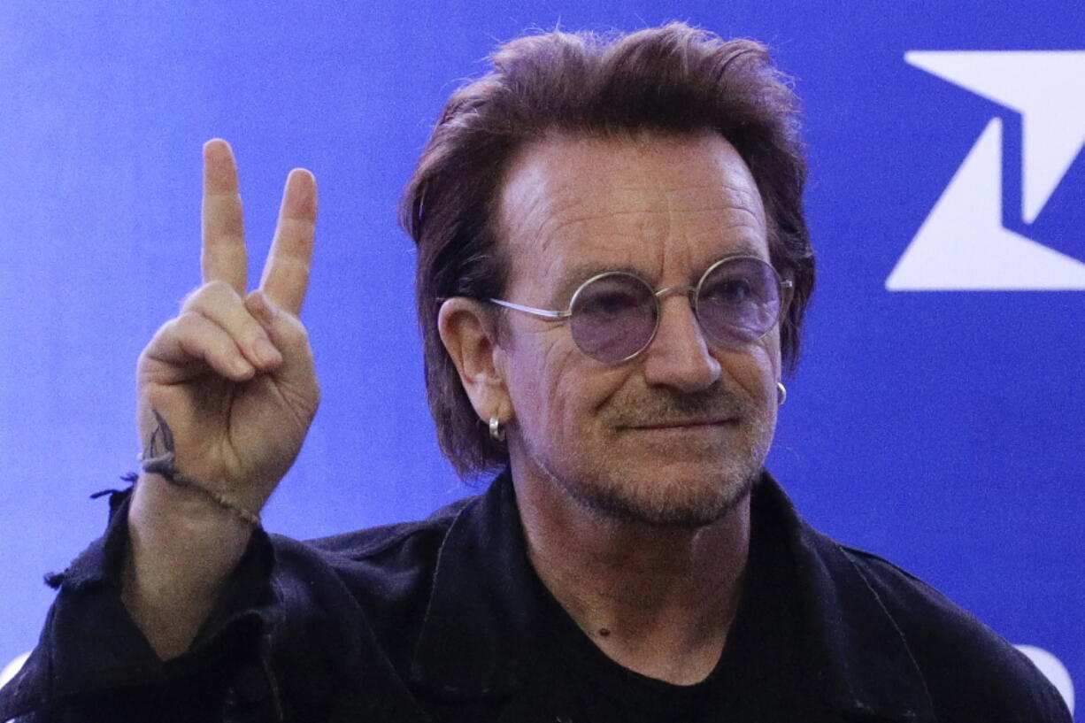 FILE - U2 singer Bono gestures as he attends the launching of the first blood by drone delivery service in the country at the Philippine Red Cross headquarters in suburban Mandaluyong, east of Manila, Philippines on Tuesday Dec. 10, 2019. Bono opened his book tour for his bestselling "Surrender: 40 Songs, One Story," on Wednesday, Nov. 2, 2022, to thousands of screaming fans at Manhattan's Beacon Theatre.