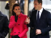 FILE - Britain's Prince William, and Kate, Duchess of Cambridge, visit the National Sept. 11 Memorial and Museum, on Dec. 9, 2014 in New York. The Prince and Princess of Wales's first overseas trip since the death of Queen Elizabeth II, which begins Wednesday, will show the world as much about what they are not as who they are.