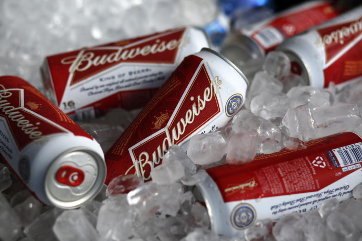 FILE - In this Thursday, March 5, 2015, file photo, Budweiser beer cans are seen at a concession stand at McKechnie Field in Bradenton, Fla. World Cup organizers reportedly have made another late change in alcohol policy only two days before games start in Qatar by banning beer sales at the eight soccer stadiums in and around Doha. Media reports say Qatari authorities are pressing FIFA to ban all sales of long-time World Cup beer sponsor Budweiser at the eight venues.  (AP Photo/Gene J.