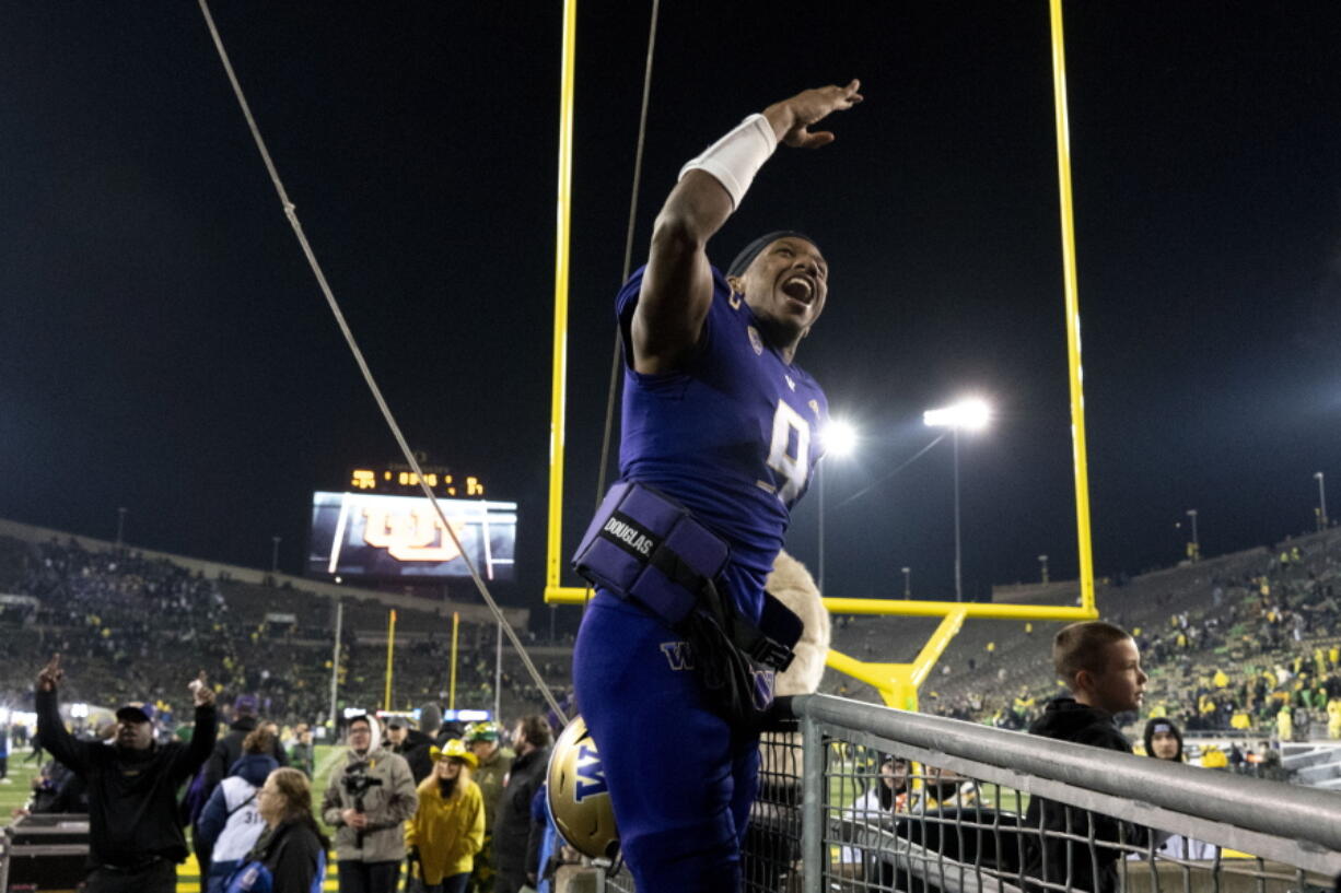 Washington quarterback Michael Penix Jr. (9) celebrates as he leaves Autzen Stadium after defeating Oregon in an NCAA college football game Saturday, Nov. 12, 2022, in Eugene, Ore.