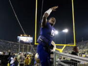 Washington quarterback Michael Penix Jr. (9) celebrates as he leaves Autzen Stadium after defeating Oregon in an NCAA college football game Saturday, Nov. 12, 2022, in Eugene, Ore.