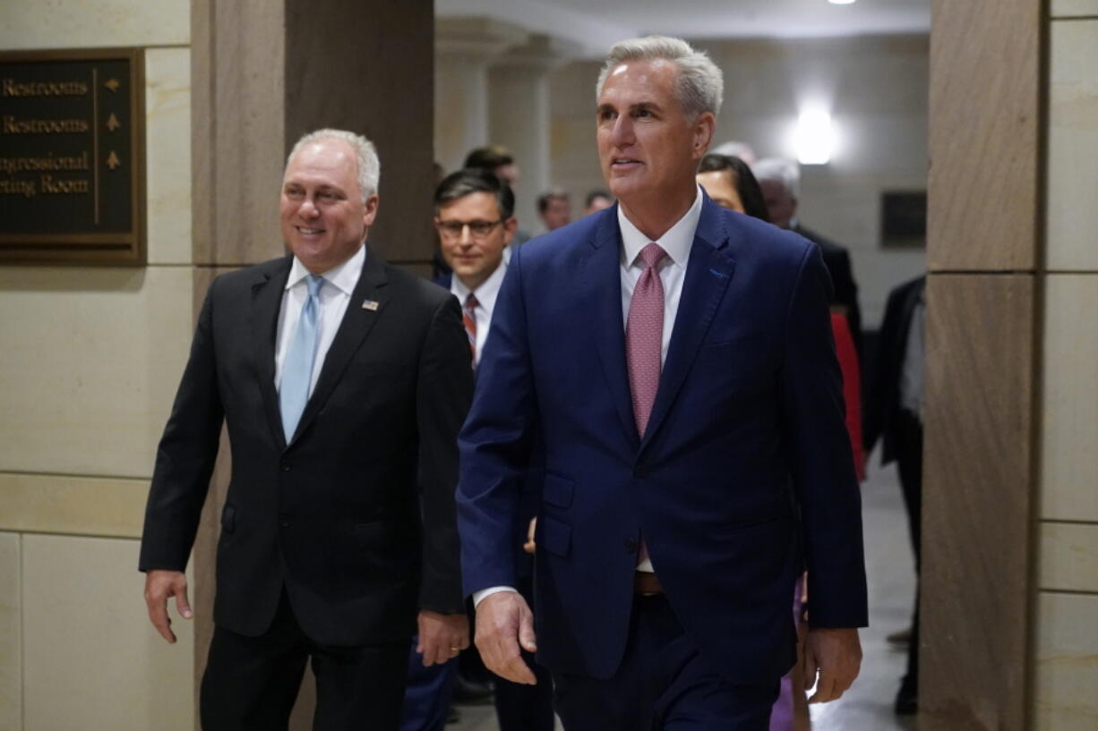 FILE - House Minority Leader Kevin McCarthy of Calif., right, and House Minority Whip Steve Scalise, R-La., arrive to speak with members of the press after a House Republican leadership meeting, Nov. 15, 2022, on Capitol Hill in Washington. McCarthy won the House Speaker nomination from his colleagues, while Scalise was voted majority leader. Even with their threadbare House majority, Republicans doubled down this week on using their new power to investigate the Biden administration and in particular the president's son.