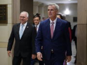 FILE - House Minority Leader Kevin McCarthy of Calif., right, and House Minority Whip Steve Scalise, R-La., arrive to speak with members of the press after a House Republican leadership meeting, Nov. 15, 2022, on Capitol Hill in Washington. McCarthy won the House Speaker nomination from his colleagues, while Scalise was voted majority leader. Even with their threadbare House majority, Republicans doubled down this week on using their new power to investigate the Biden administration and in particular the president's son.