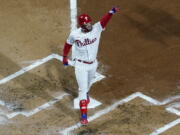 Philadelphia Phillies' Bryce Harper celebrates his two-run home run during the first inning in Game 3 of baseball's World Series between the Houston Astros and the Philadelphia Phillies on Tuesday, Nov. 1, 2022, in Philadelphia.