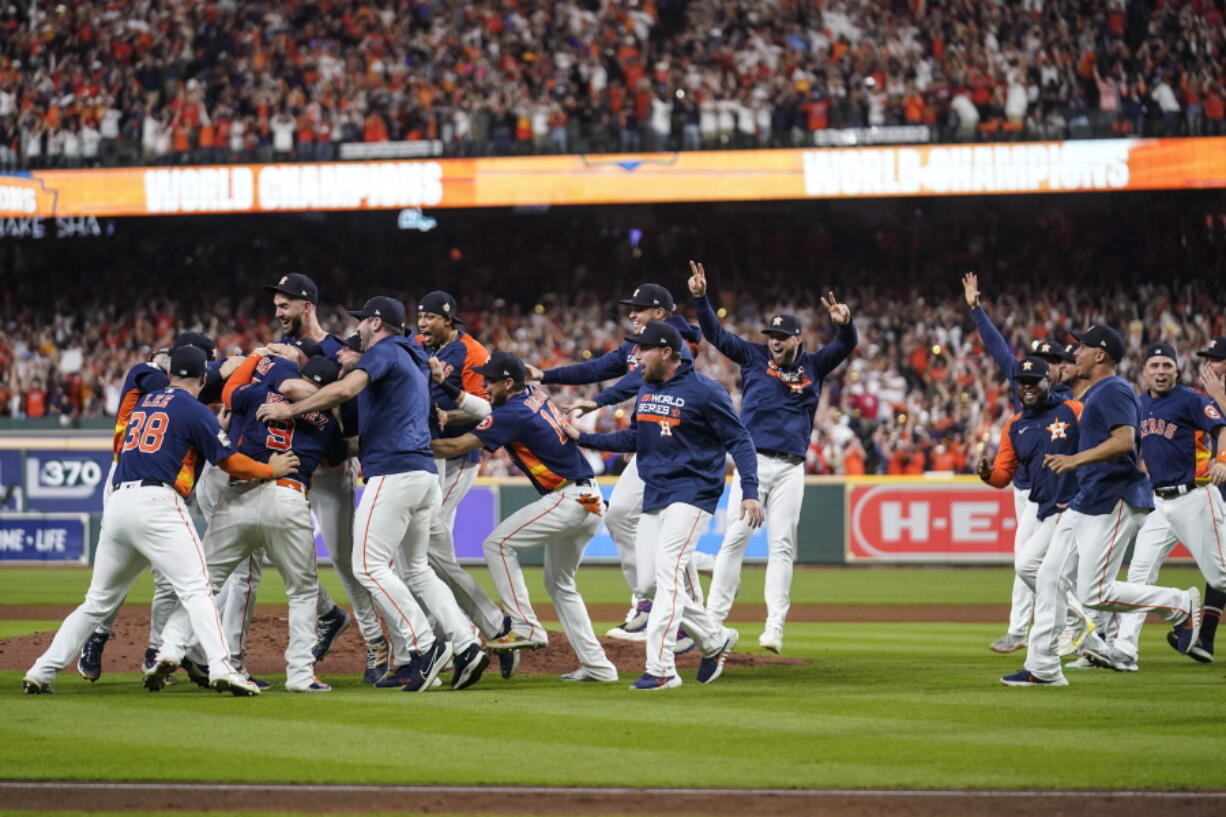 The Houston Astros celebrate their 4-1 World Series win against the Philadelphia Phillies in Game 6 on Saturday, Nov. 5, 2022, in Houston.