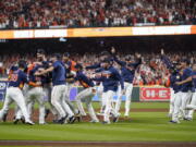 The Houston Astros celebrate their 4-1 World Series win against the Philadelphia Phillies in Game 6 on Saturday, Nov. 5, 2022, in Houston.