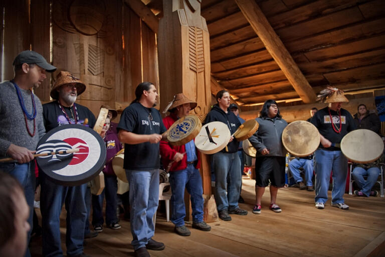 Opened in 2005, the Cathalpotle Plankhouse on the Ridgefield National Wildlife Refuge serves as a new educational and cultural home for the Chinook Indian Nation. Tribal Vice Chairman Sam Robinson, second from left, and Chairman Tony Johnson, third from left, sing and drum during a gathering there.
