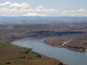 FILE - In this June 3, 2011, file photo, the Columbia River flows near the John Day Dam, east of the city of The Dalles, Ore.