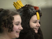 "Nutcracker" dancers Esther Tully (as Cecelia), left, and Sophie Dickman (as Le Castor, the beaver king) share a chuckle during dress rehearsal at Columbia Dance.