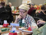 Player John Yadon of Gresham, Ore., keeps his concentration while taking on opponents during a recent 11 a.m. Wednesday weekly game at the Vancouver Bridge Club.