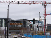 Construction cranes tower over buildings at various stages of completion as work continues at The Waterfront Vancouver this month. Around half a dozen buildings are currently or are soon to be under construction there.