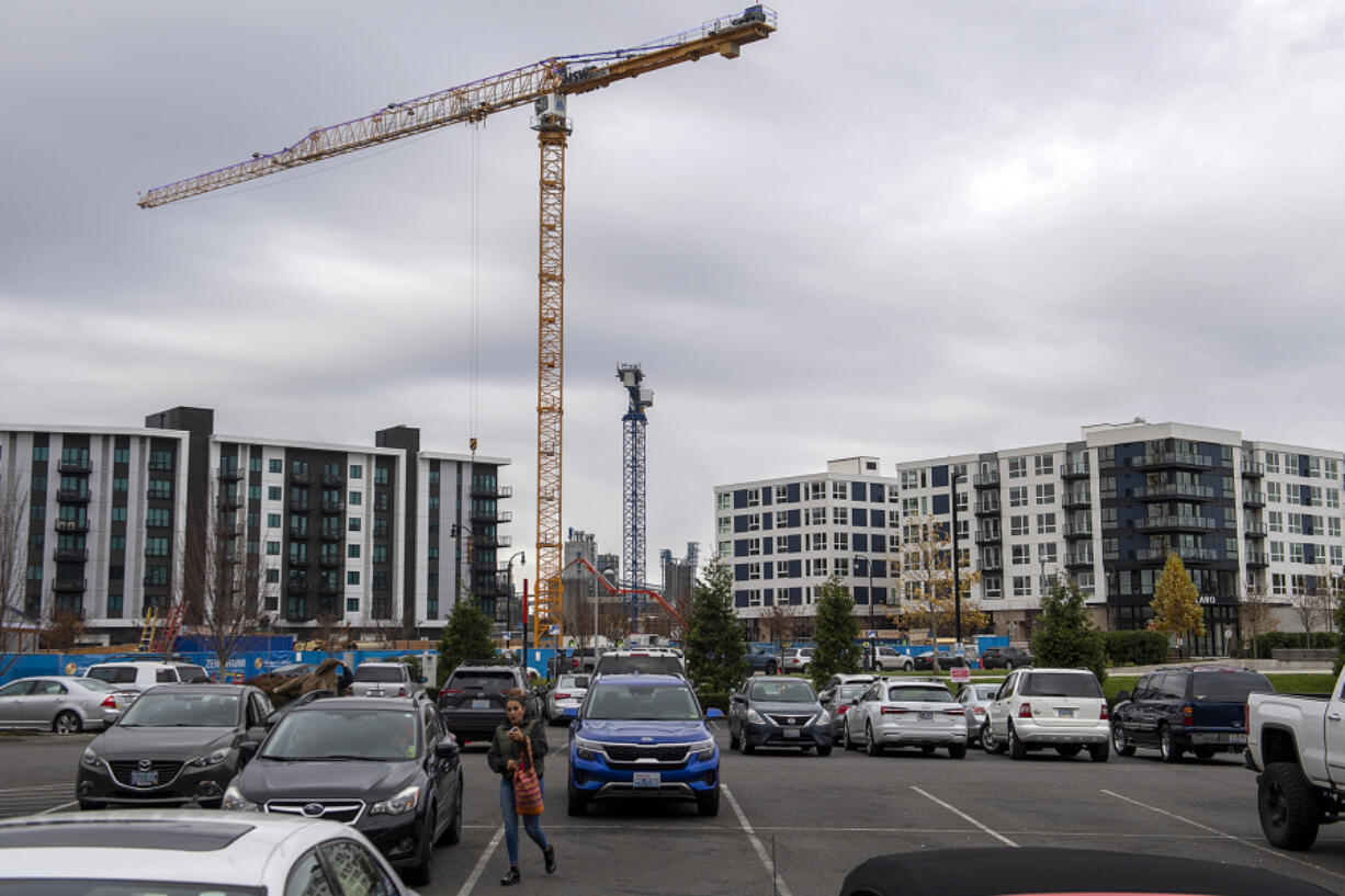 Among those buildings under construction are numerous residential towers including a senior living facility, The Springs. The parking lot in the foreground is also scheduled to become housing.