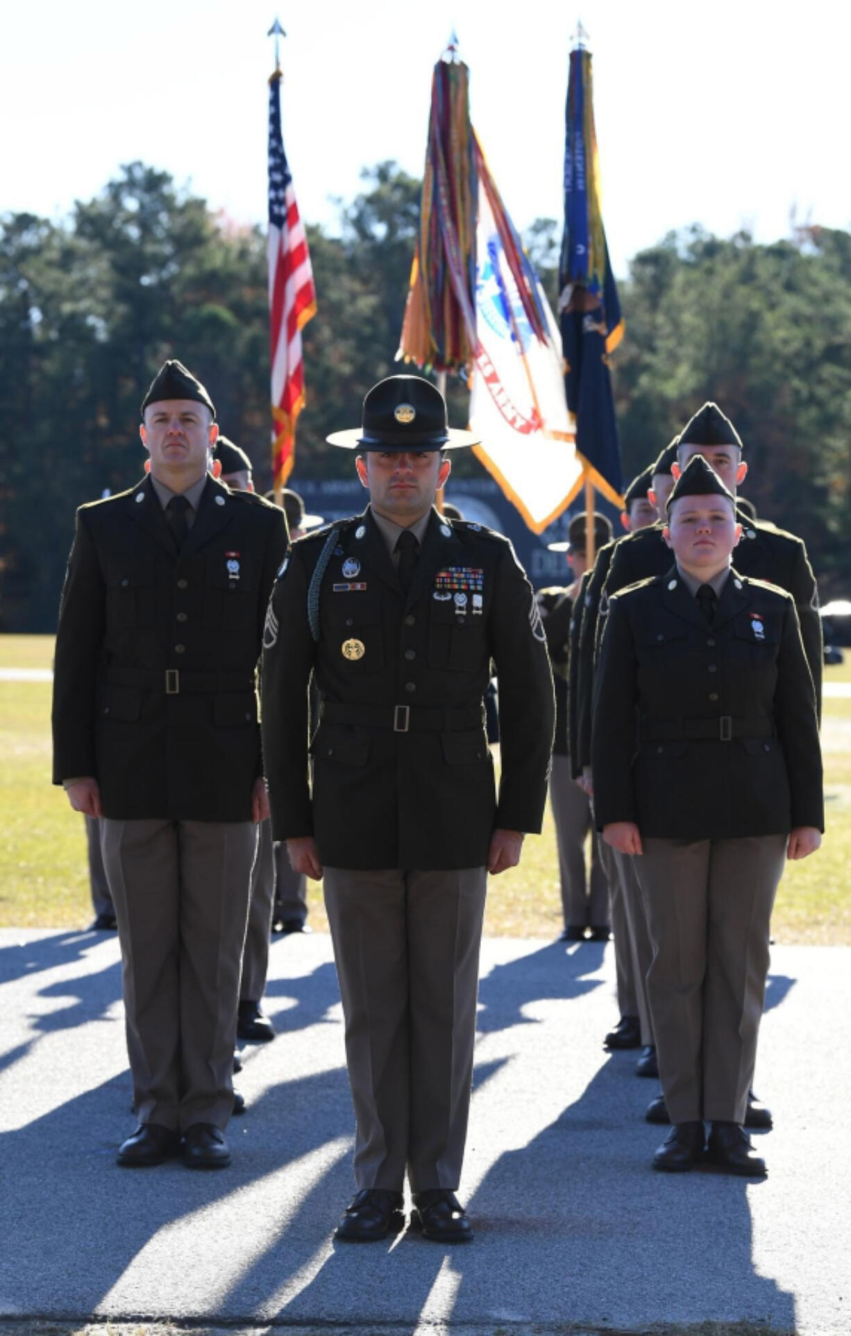 Michael Mataraza, left, stands in front of the flag guard.