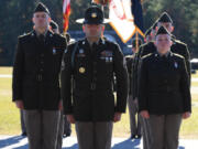 Michael Mataraza, left, stands in front of the flag guard.