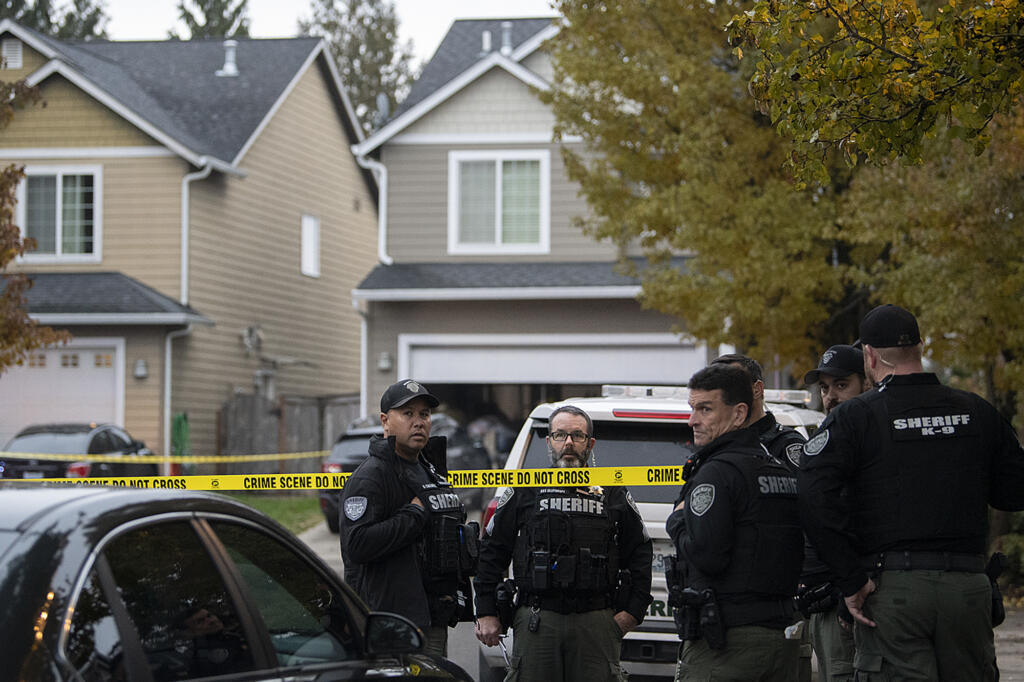 Clark County sheriff's deputies respond to the scene of a reported shooting in a home in the 15000 block of Northwest Fourth Place in North Salmon Creek on Wednesday afternoon, Dec. 7, 2022.