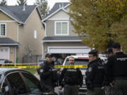 Clark County sheriff's deputies respond to the scene of a reported shooting in a home in the 15000 block of Northwest Fourth Place in North Salmon Creek on Wednesday afternoon, Dec. 7, 2022.