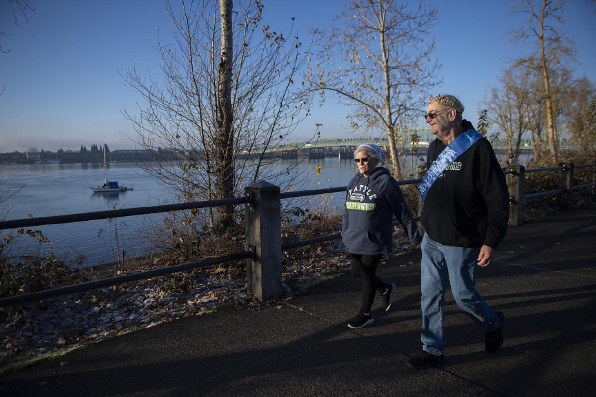 LEADOPTION Pam and George Fich keep in step along the Vancouver Waterfront. Daily exercise helped him lose 70 pounds on doctor's orders.