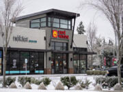 Ice-covered trees frame businesses closed temporarily due to inclement weather Friday in east Vancouver. "It's definitely an interruption to everyday business," said Jason Fish, co-owner of Main Event Sports Grill and Piehole Pizza in Vancouver and 3 Sheets at the Harbor in Portland.