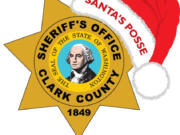 Clark County Sheriff Chuck Atkins and sheriff-elect John Horch attended the Santa's Posse toy and food packaging event on Dec. 15.