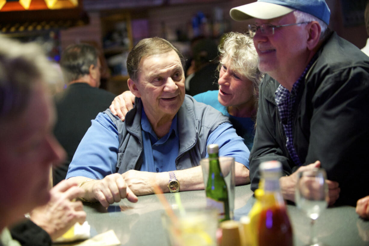 Customer Gayla Golden-Bean gives Chuck Chronis a hug on the final night of business for Chronis' Restaurant and Lounge in April 2015. Chronis died Dec. 4 at 83 years of age.